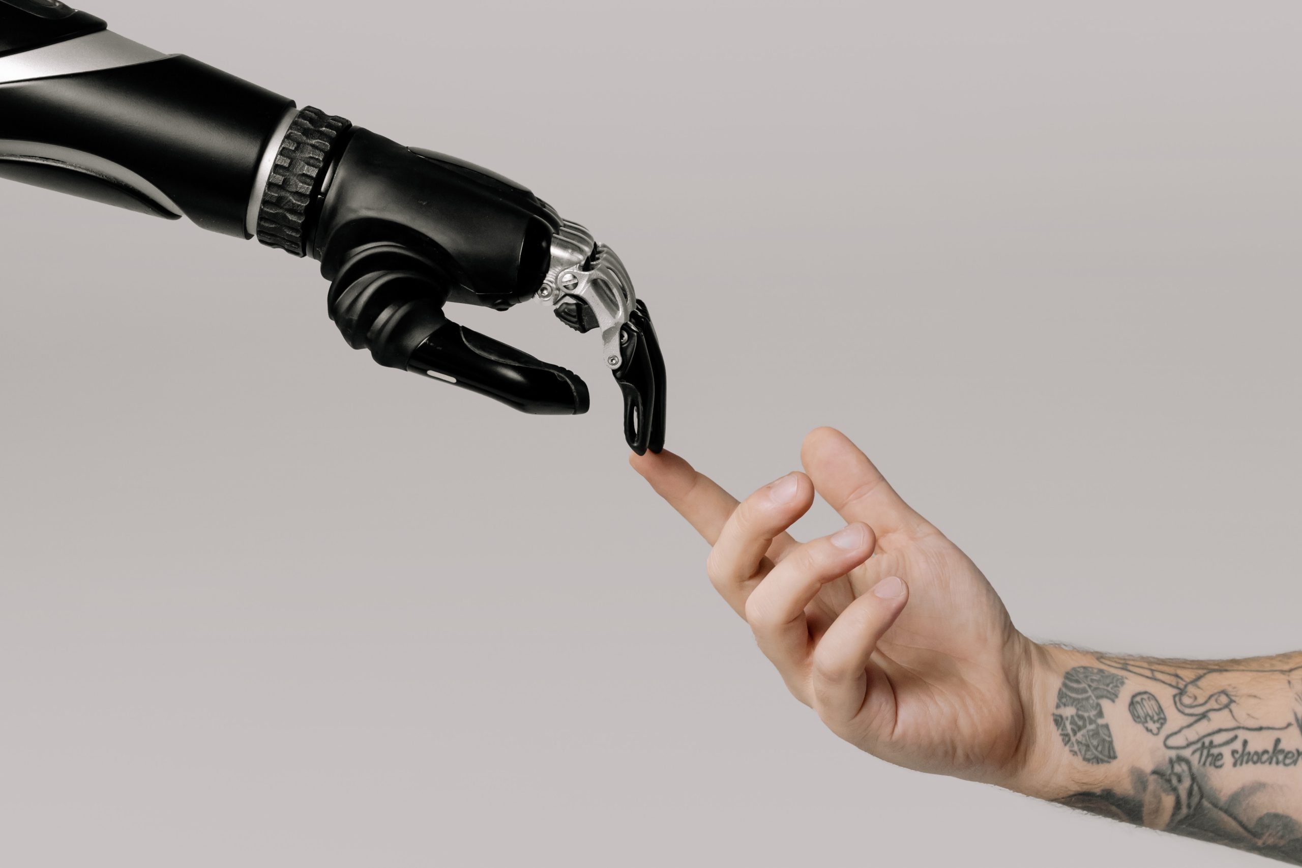 AI robot and a human hand touching