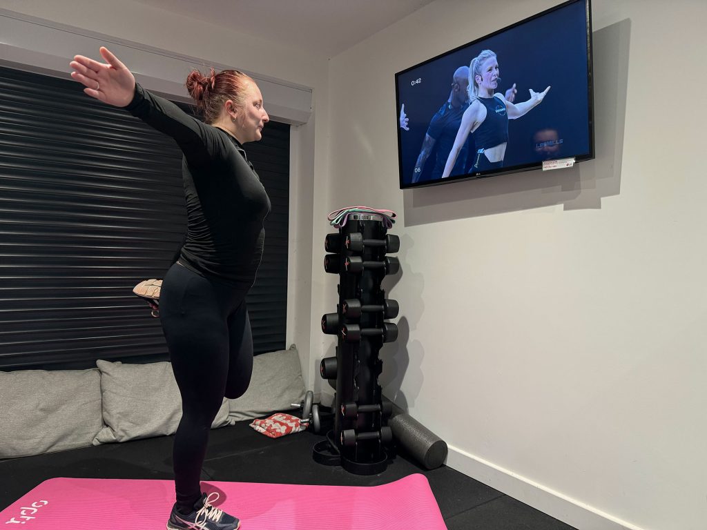 Amy stretching in the gym